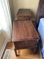 Both nightstands positioned side by side showing top plank surfaces and overall matching design