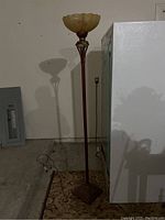 Unlit floor lamp showing shape, structure, and materials