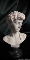 Front side view of alabaster bust showing facial features and inscription 'DAVID' on base