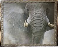 Full view of elephant artwork showing detailed elephant face and tusks with carved wooden frame.