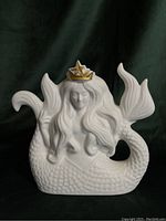 Front view of Starbucks Siren Mermaid ceramic figurine showing detailed flowing hair and star crown.