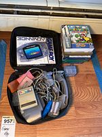 Soft zip case open showing handheld console and accessories