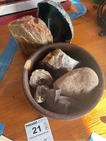 Photo showing the large rocks and the wooden bowl containing smaller rocks.