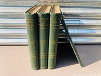Four green hardcover volumes with gold embossed titles related to flora of northern states and Canada, showing spines and cover edges.