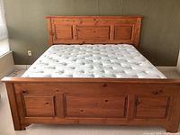 Front straight-on view of complete bed frame and mattress