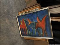 Framed acrylic painting of three abstract horses on canvas in red and blue tones.
