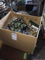 Overview image of the box full of various costume jewelry and handbag purse