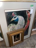 16x22 framed print showing stylized bird and woman with beige frame and visible auction lot tag
