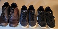 All three pairs of men's shoes sized 10.5 lined up side by side, showing Patagonia boots, Adidas sneakers, and Puma sneakers