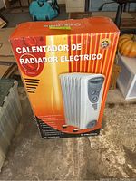 Boxed Pelonis electric radiator heater with Spanish text on box
