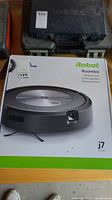 Front of original box showing iRobot Roomba J7 branding