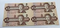 Front side of the sheet showing four uncut $2 bills with Queen Elizabeth II portrait, 1986 Canada Bird Series