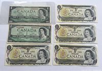 All six Canadian one dollar banknotes laid out showing front designs.