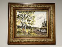 Frontal view of the oil painting in its ornate wood frame showing the entire landscape scene.