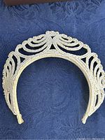 Front view of a vintage seed bead tiara showing the intricate beadwork and symmetrical design