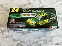Box top with image of green and yellow Jeff Gordon #24 Nicorette 2008 Impala SS die-cast stock car model and branding.