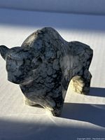 Side front view of the marble buffalo bison showing shape, texture, and coloration.