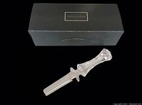Top view of Villeroy & Boch branded black box containing the crystal wine stopper.