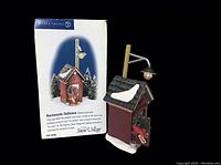 Dept. 56 Backwoods Outhouse with box showing detailed view of the outhouse and packaging.