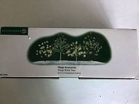Original box showing illustration and label "Village Accessories Winter Trees Set of 4" by Department 56
