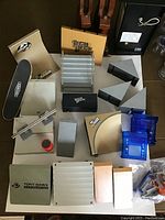 Full overview of the lot showing all ramps, miniature skateboards, and accessories arranged on a surface