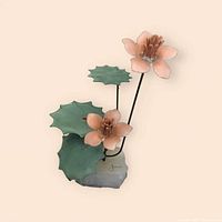 Front view of metal flower sculpture with pink flowers, green leaves, and white onyx base.