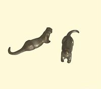 Top view of pair of Selangor Pewter otter figurines in dark pewter finish showing sculpted details and shape.