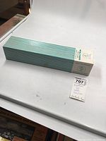 Photo showing the full sealed box with diagonal green stripes and white top with Walthers branding