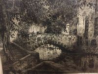 Close detail of etching showing arched stone bridge over canal and surrounding buildings