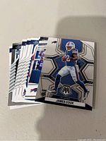 Image showing a stacked lot of Buffalo Bills NFL football trading cards with a visible James Cook card on top.