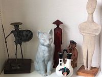 Various pottery, ceramic vases, Native American pottery, figurines including carved cat and metal statues