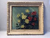 Frontal view of the framed vintage painting showing cream and red roses against a blue-green background.