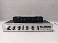 Overall front view of Realistic 31-2010 equalizer and Exim ES-1000 echo chamber stacked