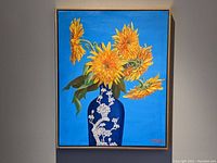 Full frontal shot of the framed painting against a neutral wall