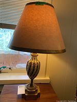 Full view of the Sevres porcelain table lamp with lampshade showing overall size and shape.