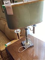 Full view of vintage table lamp showing green rectangular shade, metal body, marble base, and electrical cord.