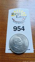 Photo of the 1965 Churchill silver coin showing the right-facing profile of Winston Churchill, with 'CHURCHILL' inscription on the edge.
