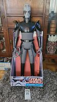 Full frontal view of a large Star Wars The Inquisitor action figure standing in its original box with visible wear to the box.