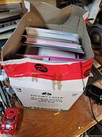 Top view of the box showing unopened greeting cards stacked inside.