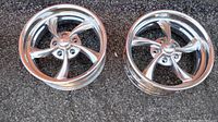 Two polished aluminum 5-spoke rims from Billet Specialties, model SLC 75, size 17x7 with 5x4.75 bolt pattern, shown on pavement surface