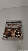 Front cover of the God of War Origins Collection game case showing the PS3 game.