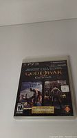 Front cover of the God of War Collection PS3 game case showing title and artwork for God of War and God of War II.
