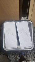 Two Ubiquiti Loco M2 Nano Station wireless access points in their unopened original retail boxes shown from the front.