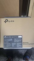 Packed TP-Link Omada ER7206 Gigabit VPN Router showing front of box with branding and product info.