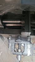 Close up photo of metal vise showing screw mechanism and clamping jaws