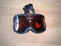 Front view of Alpina ski goggles showing full lens and strap