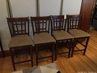 All four bar height stools side by side, front view