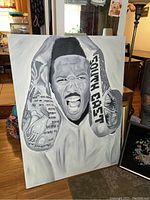 Full view of original canvas painting showing a man with boxing gloves and expressive face