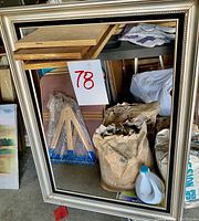 Large silver-colored frame placed vertically, no glass present.