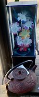 Flower in box display with artificial flowers in black box case